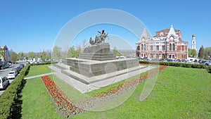 Monument of Chapaev and grassplot with flowers photo