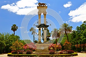 Monument of Christopher Columbus decorated with the prows of two ships and a lion in the garden de Murillo in Seville, capital of photo