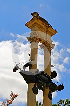 Monument of Christopher Columbus decorated with the prows of two ships and a lion in the garden de Murillo in Seville, capital of photo