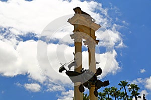 Monument of Christopher Columbus decorated with the prows of two ships and a lion in the garden de Murillo in Seville, capital of photo