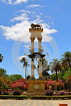Monument of Christopher Columbus decorated with the prows of two ships and a lion in the garden de Murillo in Seville, capital of photo