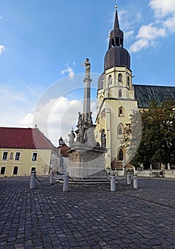 Monument and a church of saint Nicholas in centre of Trnava, Slovakia.