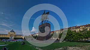 Monument of the Croatian King Tomislav timelapse hyperlapse and art pavilion in colorful park, in Zagreb, capital of photo