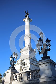 Monument with a fountain & towering column in the Place des Quinconces, Bordeaux, France. photo