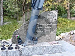 Monument, granite inscription in Russian - `Russian volunteers heroically fallen in the battles for Donbass.`