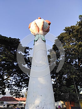 Monument of Hand Holding Coconut Shoot in Dili photo