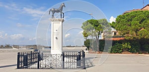 Monument with a horse on the embankment in the city of Cavallino, Venice.