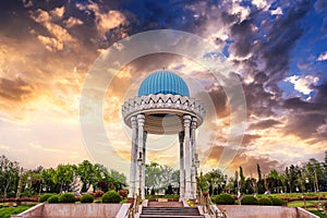 monument Patriots Memorial white rotunda with a blue dome in park in spring in Tashkent in Uzbekistan