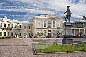 Monument of russian emperor and classical palace
