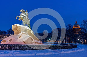 Monument of Russian emperor Peter the Great and St Isaac Cathedral in Saint Petersburg. Russia