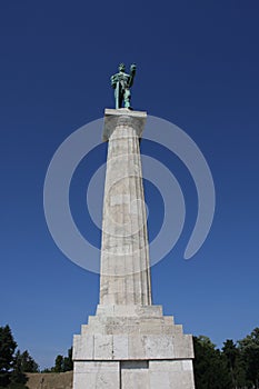 Monument sculpture of the Belgrade Victor made of bronze, located in Kalemegdan park facing the Sava River and Zemun district, Bel
