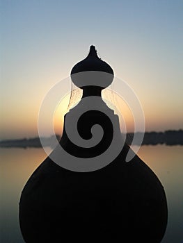 Monument silhouette with sunrise background photo