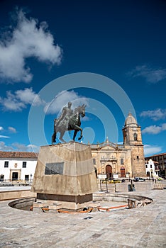 Monument of Simon Bolivar in the square with colonial style architecture in the city of Tunja. Colombia.