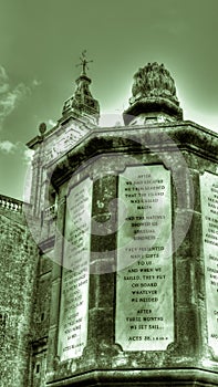 Monument with the tables next to Grotto and Parish Church