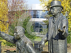 Monument to Brothers Lumiere. Next to the figures of the brothers,their invention-a movie camera