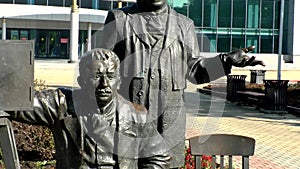 Monument to Brothers Lumiere. Next to the figures of the brothers,their invention-a movie camera