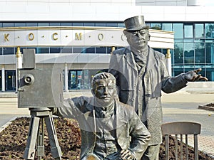 Monument to Brothers Lumiere.Next to the figures of the brothers,their invention-a movie camera photo