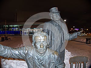 Monument to Brothers Lumiere. Night. Next to the figures of the brothers, their invention a movie camera photo