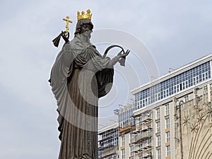 Monument to Catherine on the background of a modern building