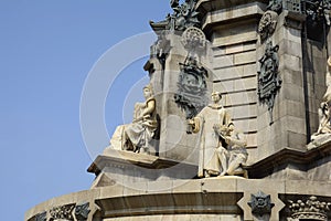 Monument to Columbus in Barcelona.Columbus points toward the sea.The cast-iron monumental column on which Columbus stands is