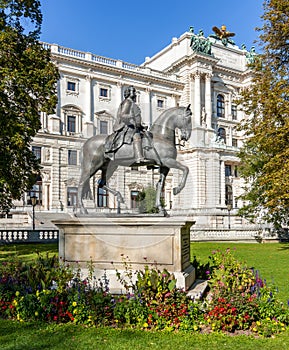 Monument to emperor Franz Stephan I in Burggarten park with Hofburg palace at background, Vienna, Austria