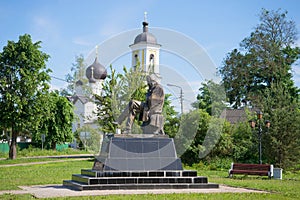 The monument to F. M. Dostoevsky at the St. Nicholas Church on a june day. Staraya Russa, Russia