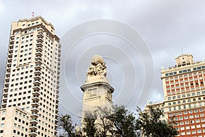 Monument to Miguel de Cervantes between two skyscrapers, Madrid, Spain