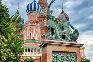 Monument to Minin and Pozharsky and St Basil`s cathedral on Red Square. Moscow, Russia-June 2019