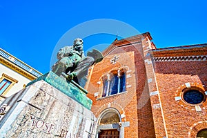 The monument to Mose Bianchi at the facade of Chiesa di San Pietro Martire church in Monza, Italy photo