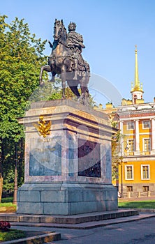 Monument to Peter the Great near the Mikhailovsky Castle in St. Petersburg. On the pedestal there is an inscription in Russian