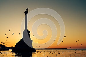 Monument to sunken ships in Black sea water on sunset. Sevastopol, Crimea