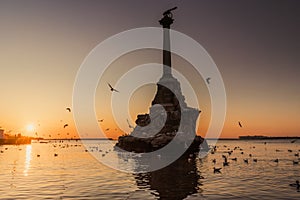 Monument to sunken ships in Black sea water on sunset. Sevastopol, Crimea