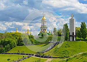 Monument to victims of Holodomor and Kiev-Pechersk Lavra in Kiev