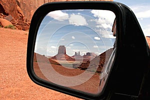 Monument valley in car mirror.