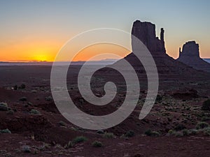 Monument Valley at Sunrise with view of West Mitten Butte and East Mitten Butte, Arizona, USA