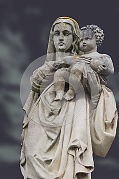 Monument of the woman with the child on a cemetery