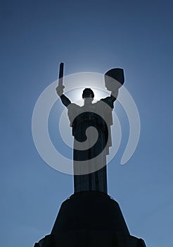 Monumental statue of the Â«Mother MotherlandÂ» with solar halo a