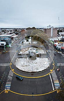 Monumento a la Manzana during snowfall aerial view. General Roca, Rio Negro, Argentina photo