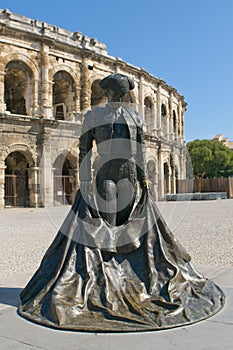 Monumetnt of matador in front of Arenas of Nimes photo