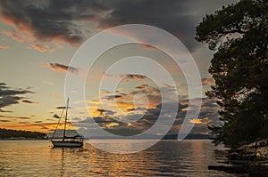 Moody clouds clouds during sunset over Adriatic bay in Splitska on Brac island, Croatia