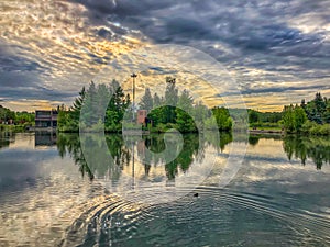 Moody Clouds Over A Lake