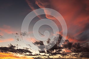 Moody cloudscape, with beautifully colored clouds at dusk