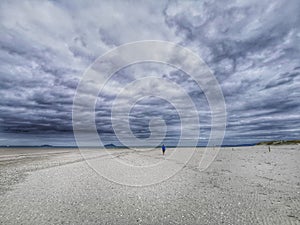 Moody cloudy sky on an ocean beach in New Zealand