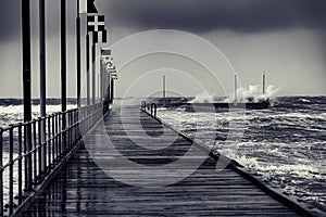 Moody Frankston Pier as Windy Storm Batters with Crashing Waves
