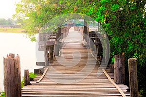 Moody image of old textured wooden boardwalk, Ubein bridge, Amarapura, Myanmar