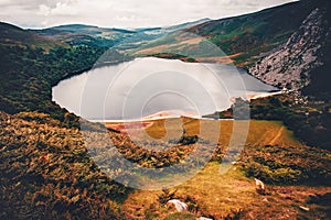 Moody landscape of hills and lake in Wicklow Mountain, Ireland