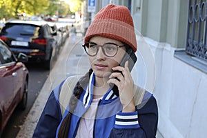 Moody looking young woman on the phone