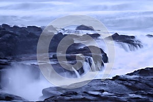 Moody Misty Ocean Seascape landscape of rocky beach