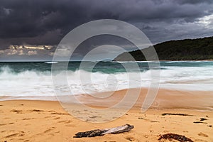 Moody morning bay seascape with rain clouds