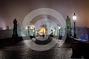 Moody night view over the famous Charles Bridge in Prague, Czech Republic,